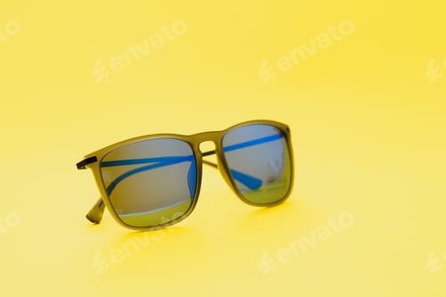 Preview: Stylish sunglasses on a yellow background High quality photo Sunglasses.