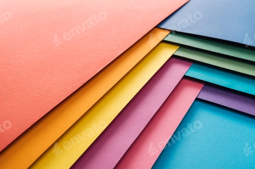 Preview: flat lay of blue, orange, green, burgundy, yellow, pink and purple sheets of paper