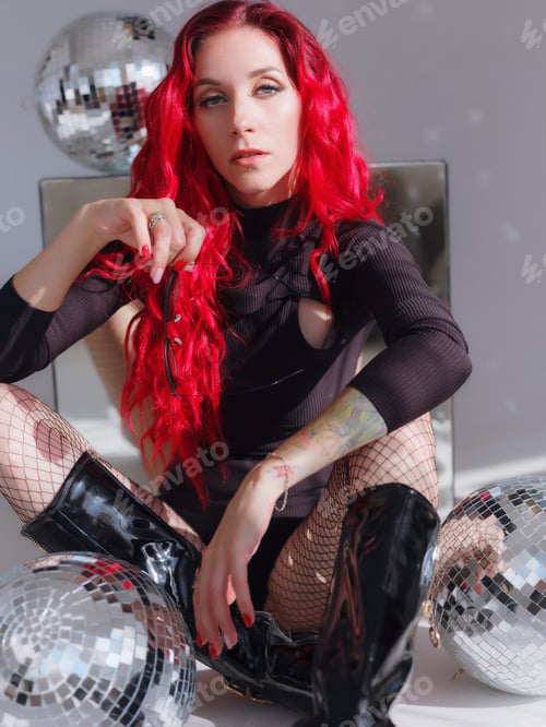 Preview: Woman in black bodysuit and Disco Ball.