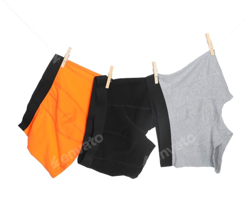 Preview: Comfortable men's underwear on clothes line against white background