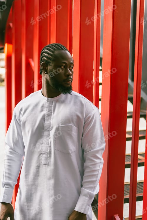 Preview: Cheerful male tourist portrait dress in white wear dashiki ethnic smiling at city street or small