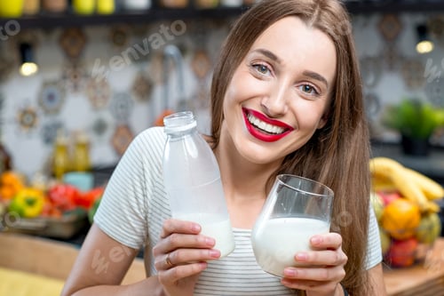 Preview: Woman with milk in the kitchen