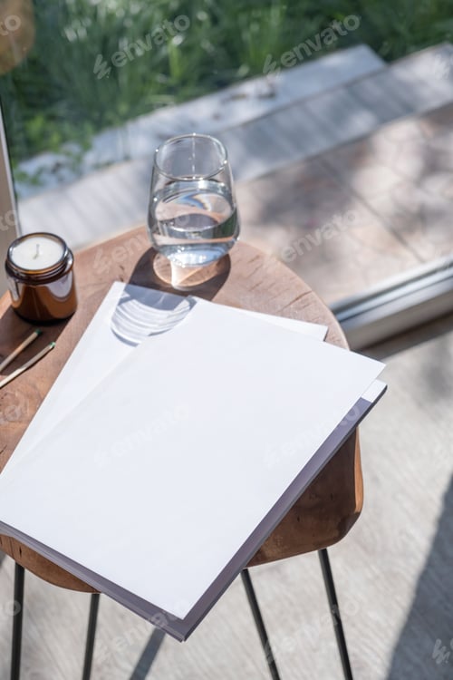 Preview: Magazine and book mockup design. Blank magazine on modern wooden table with candles , shadow overlay