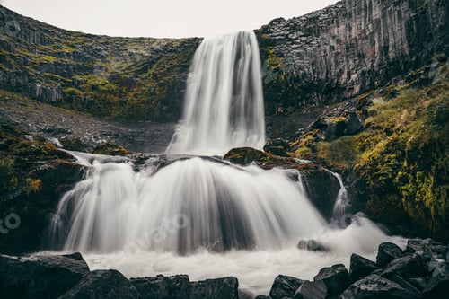 Preview: Long exposure shot of a flowing cascading waterfall
