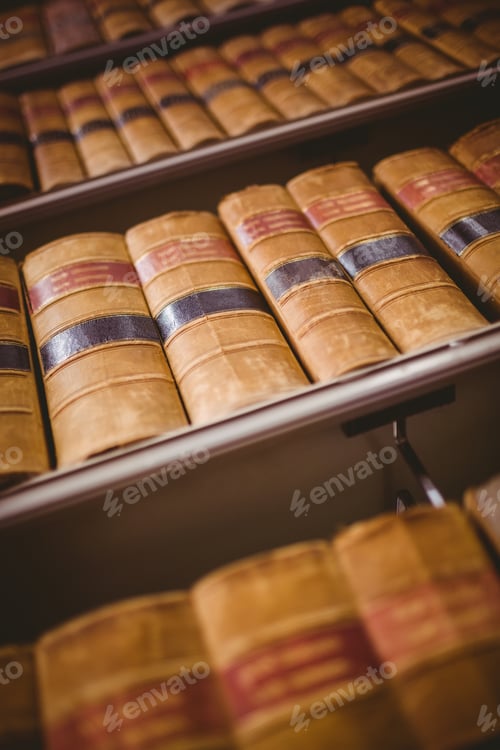 Preview: Close up of shelf with old books in library
