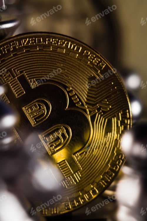 Preview: Vertical closeup of a bitcoin. Shallow focus.