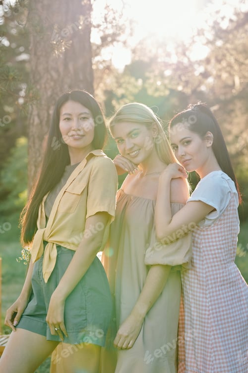 Preview: Group of pretty young females of Asian and Caucasian ethnicities standing in row