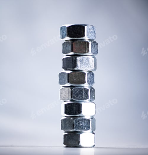 Preview: Working tool. Metal nuts on the table.