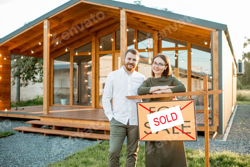 Preview: Couple in front of their new house