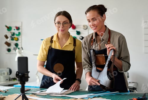 Preview: Young tanner showing handmade leather attire to online audience
