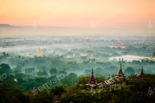 Preview: Aerial view of towers in misty landscape