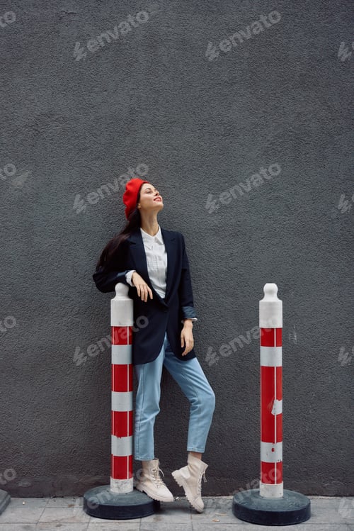 Preview: Fashion woman standing on the street in front of the city and road works tourist in stylish clothes