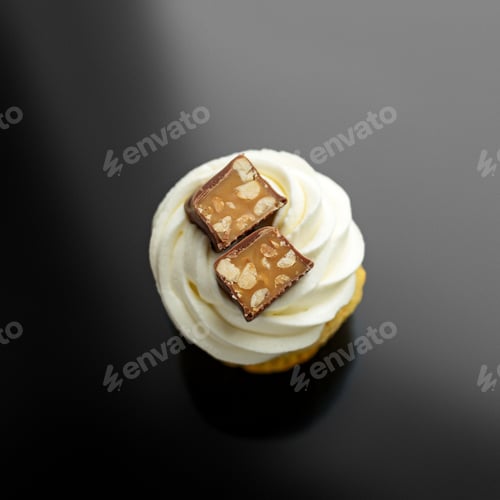 Preview: Cupcake with delicate cream and chocolate. Top view. The concept of food, desserts, holiday.