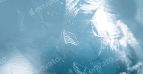 Preview: Texture of ice covered glass against blue background
