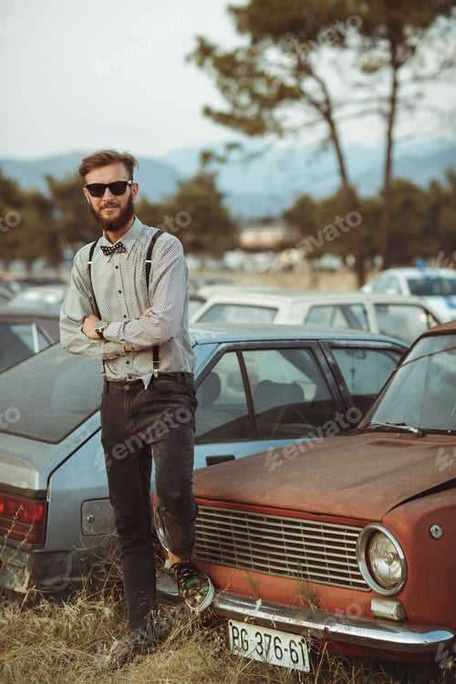 Preview: Young handsome stylish man, wearing shirt and bow-tie on the fie