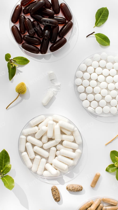 Preview: Various vitamins, tablets and dietary supplements with natural formulations on a white background.