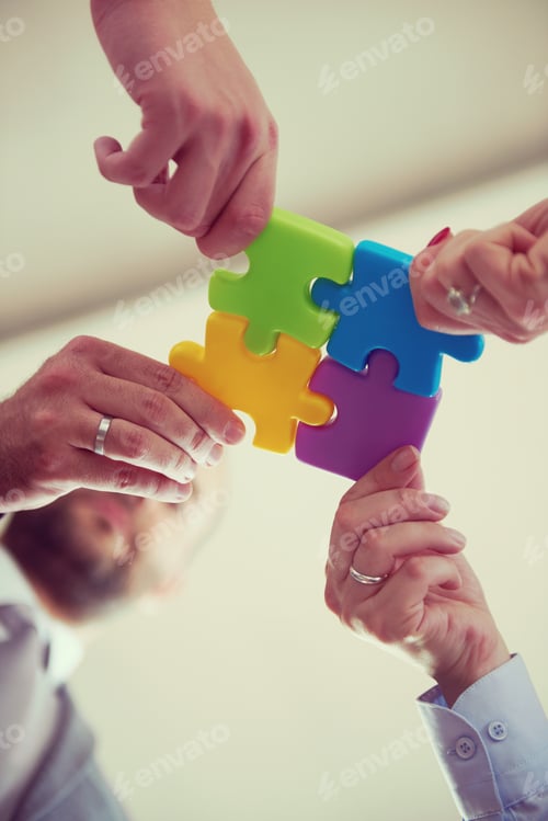 Preview: business people group assembling jigsaw puzzle