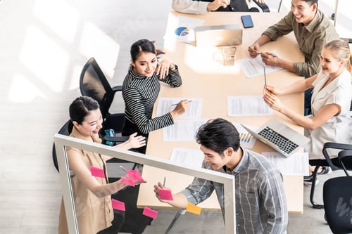 Preview: Group of businessman and woman brainstorm to solve problem, presentation new idea in office
