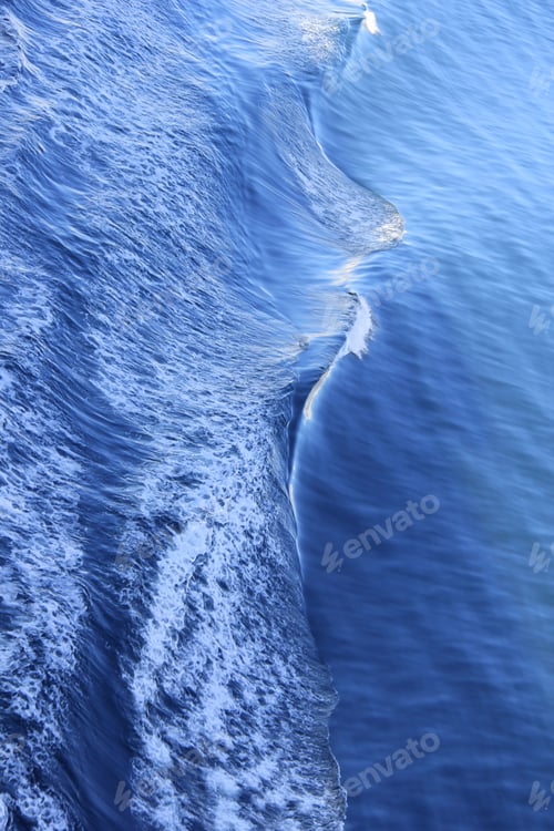 Preview: Gorgeous aerial view of the majestic blue ocean with natural ripples and waves as it moves.