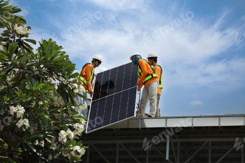 Preview: Technicians Install photovoltaic solar modules on roof of house