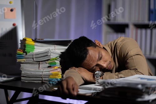 Preview: Business people in the night office who work overtime are sleepy and tired from overwork.