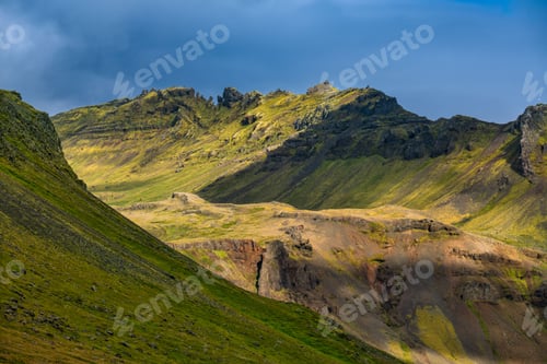 Preview: Scenic mountain landscape with green slopes.