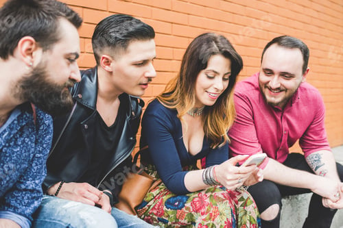 Preview: Friends sharing a laugh over a smartphone.