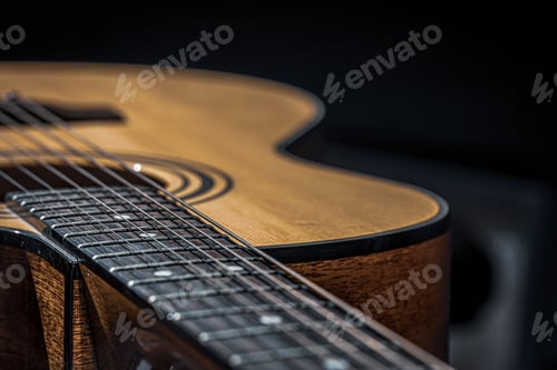 Preview: Close-up of a classical acoustic guitar in beautiful lighting.