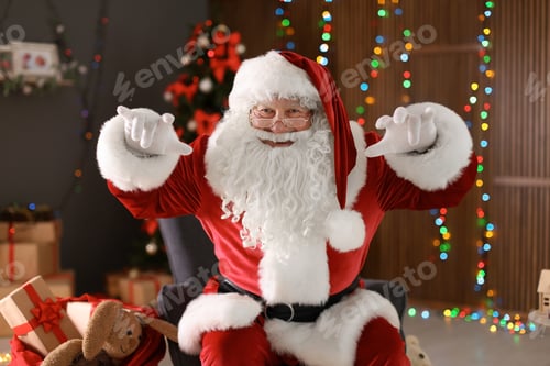 Preview: Authentic Santa Claus showing funny gestures indoors