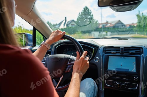 Preview: Driving modern car with GPS navigation system on sunny day
