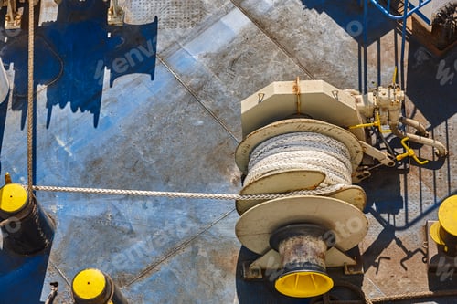 Preview: Anchord lanyard and motor equipment on a ship deck. Rope