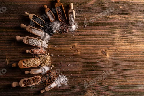Preview: Variations of Salt in Wooden Scoops on Wood
