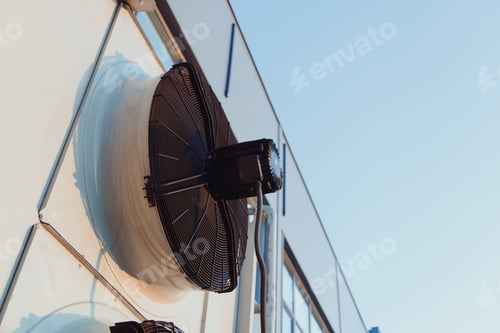 Preview: Outdoor unit of industrial air conditioning system or refrigeration machine, close-up fan