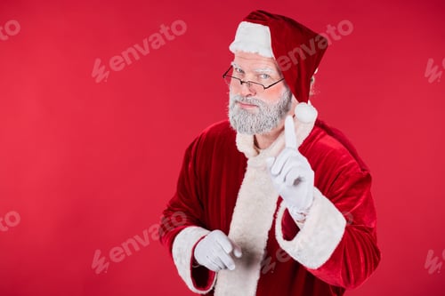 Preview: Santa Claus Holding His Finger Up in Red Background