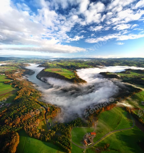 Preview: Vertical shot of the Danube curve at sunrise with morning fog