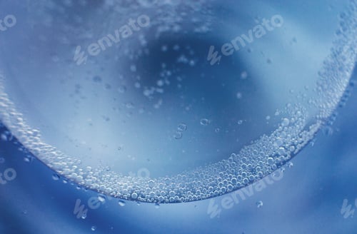 Preview: abstract light blue background with oil circles . bubbles of water close up
