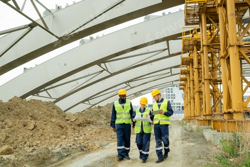 Preview: Contemporary engineers discussing working document