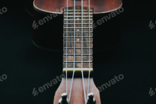 Preview: Closeup shot of a wooden ukulele with strings