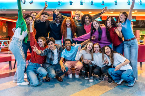 Preview: Happy multiethnic friends enjoying bowling alley games