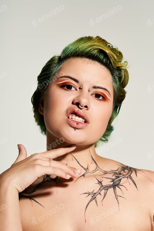 Preview: Fashion forward young woman exuding confidence with vibrant makeup and bold style