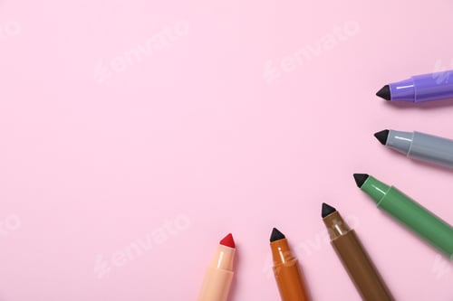 Preview: Many colorful markers on pink background, flat lay. Space for text