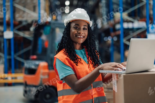 Preview: Warehouse african american woman worker confident in tech use for logistics