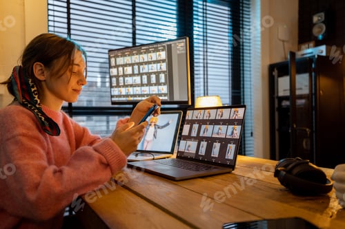 Preview: Photographer editing photos at home office
