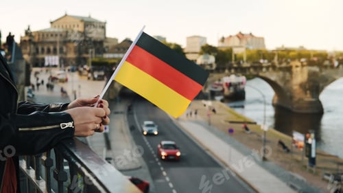Preview: Young Woman Holds German Flag In Hand