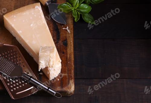 Preview: hard parmesan cheese on a wooden board