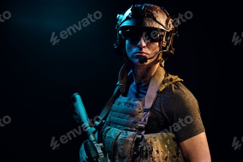 Preview: Special forces soldier with rifle on black background