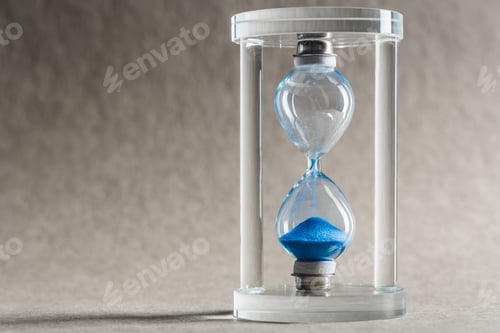Preview: Close up hourglass on table