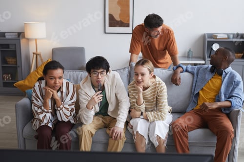 Preview: Group of Young People Watching TV