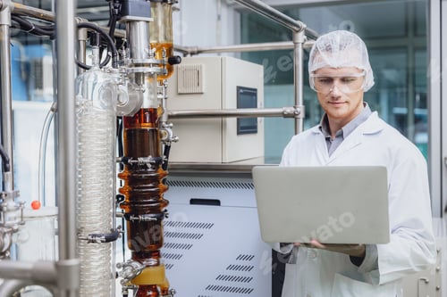 Preview: Scientist working with Equipment in Science Lab. Medical factory staff Cannabis CBD oil extraction.