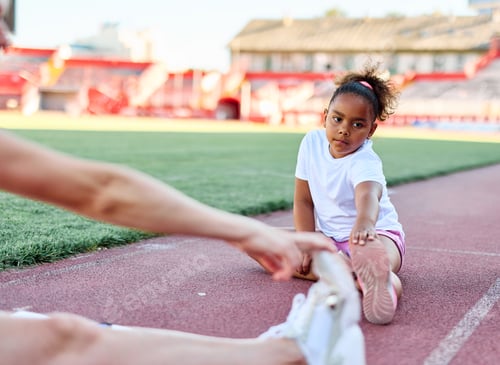 Preview: Children at a sport class on a stadium